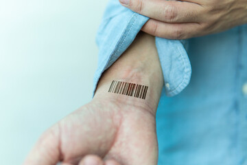 Bar code is on man hand. Clone of DNA and human genome. The concept digital electronic cards, tracking during the pandemic, in quarantine. Mass chipization of the world's population. Global control, - obrazy, fototapety, plakaty