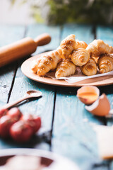 A dough rolls called Kiflice served on wooden background