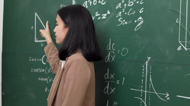 Young asian teacher woman teaching speak to camera video conference with student. Female teacher training the mathematics in classroom blackboard online course.
