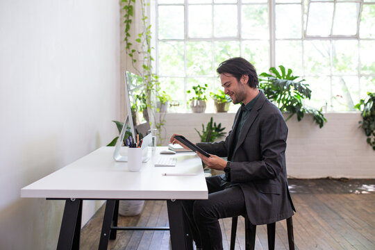 Side view of a man working in a renovated office
