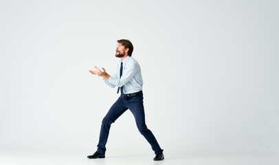 Fototapeta na wymiar man in suit emotions office jump light background