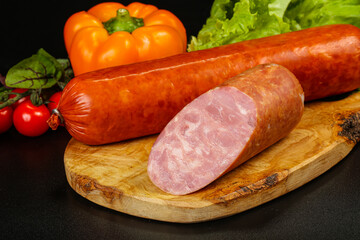 Pork ham sausage cut isolated