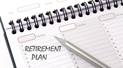 RETIREMENT PLAN on the planner with pencil, business concept