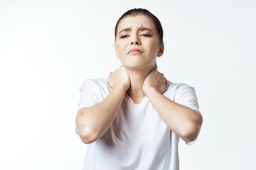 sick woman in white t-shirt pain health problems dissatisfaction