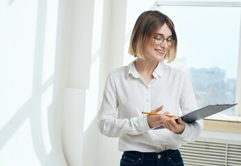 Business woman in white shirt documents official manager
