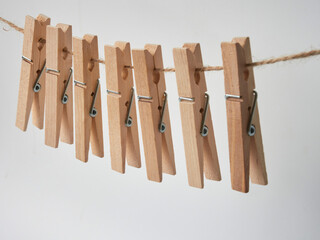 Set of wooden clothes pins on white background