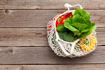 Eco friendly mesh shopping bag with fresh vegetables