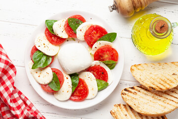 Caprese salad with mozzarella, basil and garden tomatoes