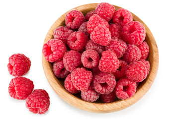 ripe raspberries in wooden bowl isolated on white background. clipping path. top view