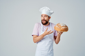 bearded man in white apron bread baking service