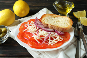 Concept of tasty food with tomato carpaccio on rustic wooden table