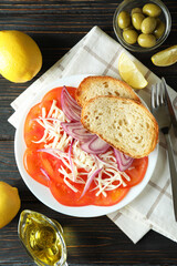 Concept of tasty food with tomato carpaccio on rustic wooden table