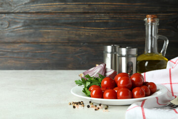 Concept of pickled vegetables with tomatoes on white textured table