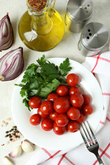 Concept of pickled vegetables with tomatoes on white textured table