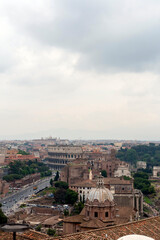 Fototapeta na wymiar The Colosseum on a cloudy summer day in Rome