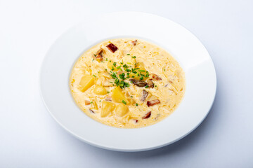 Traditional Wallachian sour soup with potatoes and cabbage