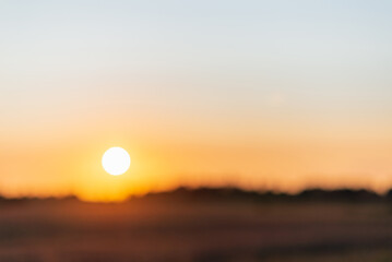 Blurred sunset landscape.Summer holiday concept. blurry beautiful sunlight and golden sunset background.