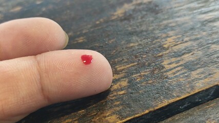 Drops of blood from the fingertips due to blood draws to test for diabetes