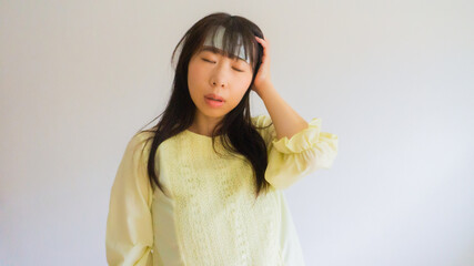 体調不良の女性