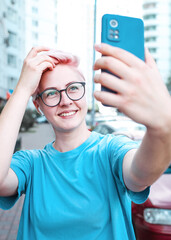 Taking selfie self portrait photos on smartphone. 