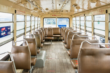 Bangkok, Thailand -August, 04, 2021 : Empty leather seat inside the vintage auto bus of bangkok...