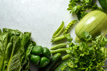 organic vegetables-zucchini, cucumbers, peppers, carrots on a light background