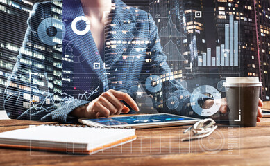 Businesswoman using tablet computer at desk