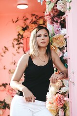 The girl in the flowers. In white and black clothes. Youth.