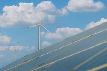 Photovoltaics solar panel and wind turbines generating electricity. Alternative energy from...