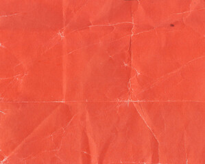 Orange old paper background with crumpled effect