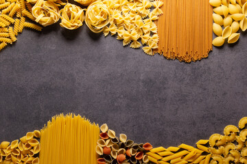 Pasta collection food on table background. Raw pasta assortment at tabletop