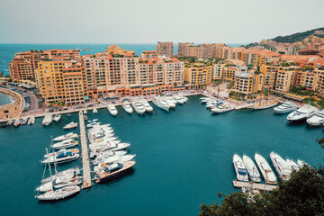 Fototapeta na wymiar Harbor with yachts and boats in Moncte Carlo, Monaco