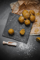 Traditional Indian sweets laddu served on black background