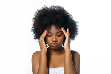 african woman with headache on white background