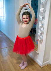 Little girl posing dressed up as a ballerina