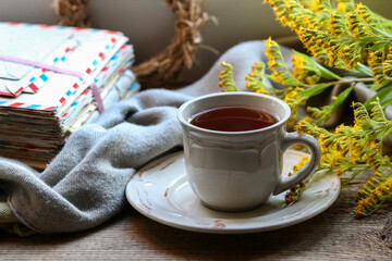 A cup of tea among autumn plants.