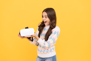 Naklejka premium modern wireless technology. childhood development. amazed teen girl hold wireless VR glasses.