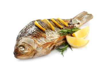 Tasty homemade roasted crucian carp with rosemary and lemon on white background. River fish