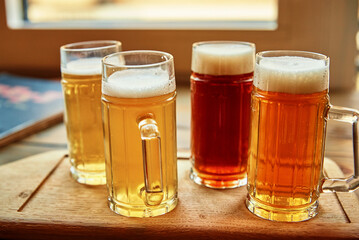 Beer set in the pub. Different kind of beer in glasses on table