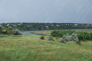 Beautiful view of river on grey day. Rainy weather