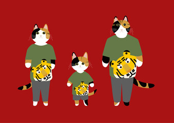 寅年にちなみ寅の絵のTシャツを着る三毛猫の親子　年賀状