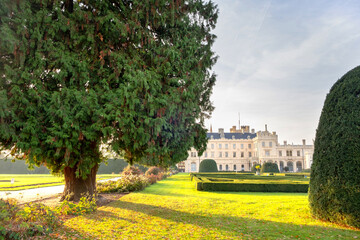 Fototapeta premium Green gardens in Lednice castle Chateau yard in Moravia, Czech Republic. UNESCO World Heritage Site.