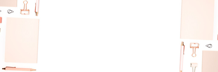 Banner with pink office stationery on a white background. Neat workspace with place for text.