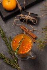 hot sea buckthorn drink on a gray background. top view