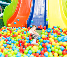 Child plays fun in the entertainment center. Game center