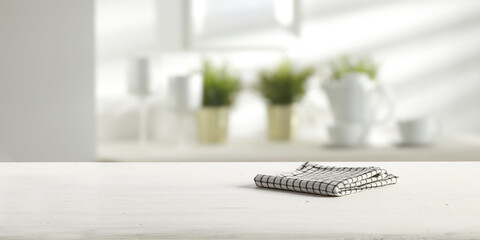 White wooden desk with napkin and kitchen interior 