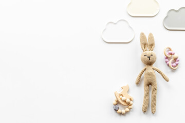 Baby toy rabbit with wooden accessories, overhead view