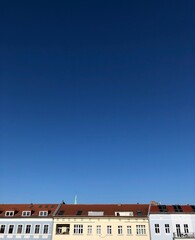 Fototapeta na wymiar view of the rooftops and blue sky from the window, Germany