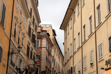 Fototapeta na wymiar Buildings on a summer street in Rome