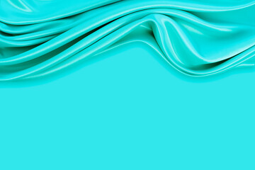 Beautiful elegant wavy turquoise satin silk luxury cloth fabric texture with monochrome background design. Copy space